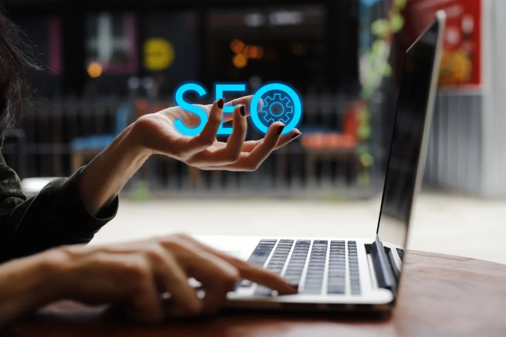 Person working on SEO strategies in front of a laptop