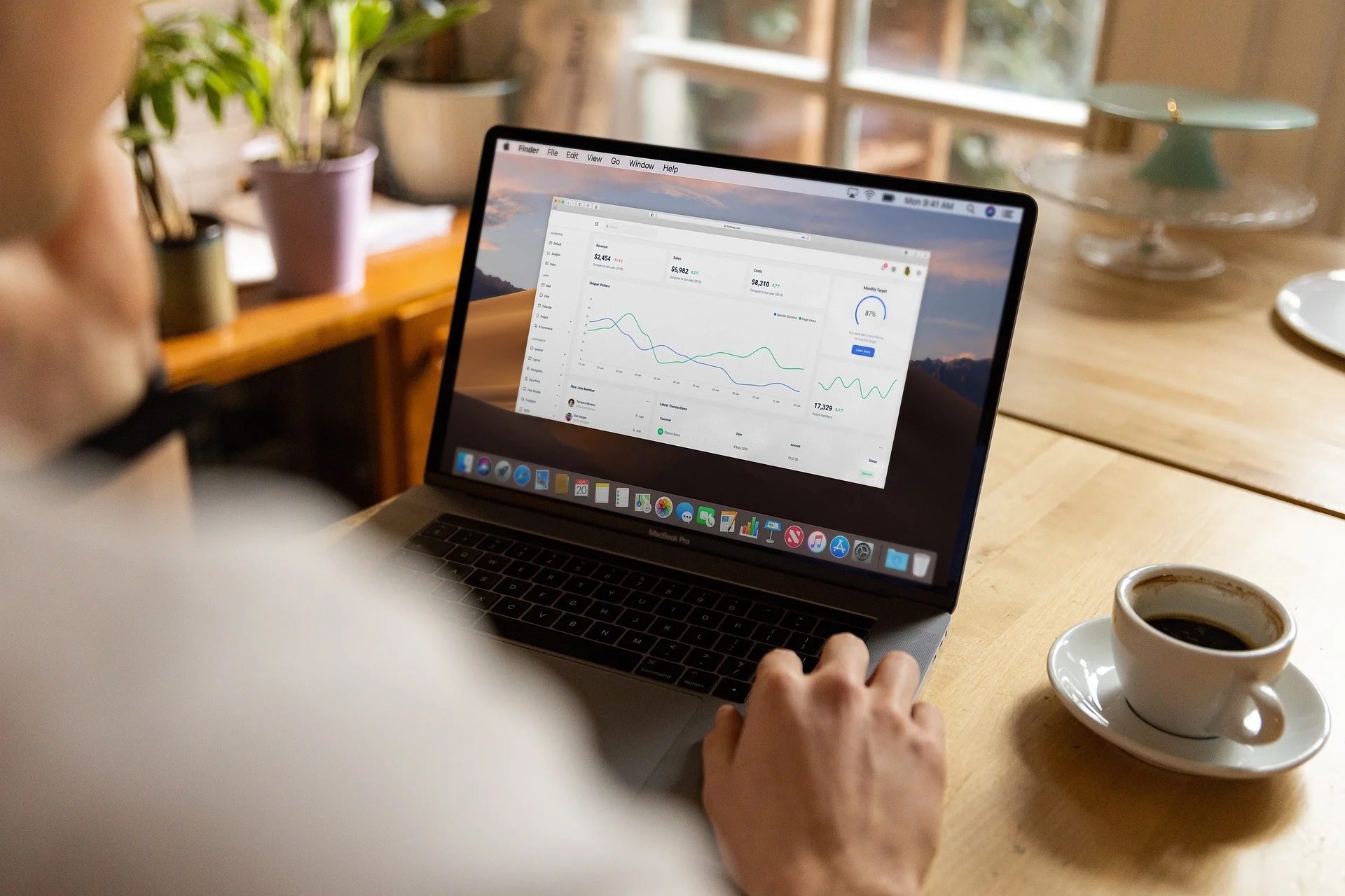 A person analyzing a local SEO heat map on a laptop.