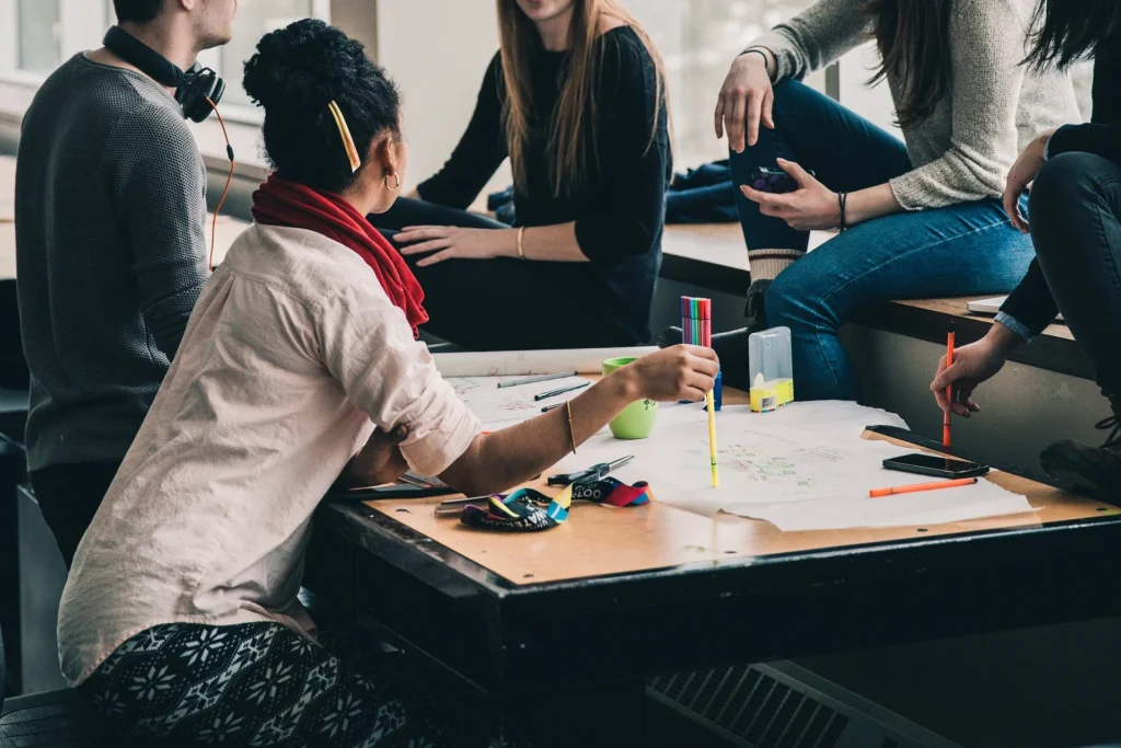 Employees collaborating on a planning session, fostering a positive company reputation.