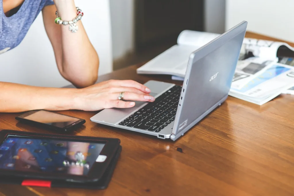 Business professional using laptop for online reputation management