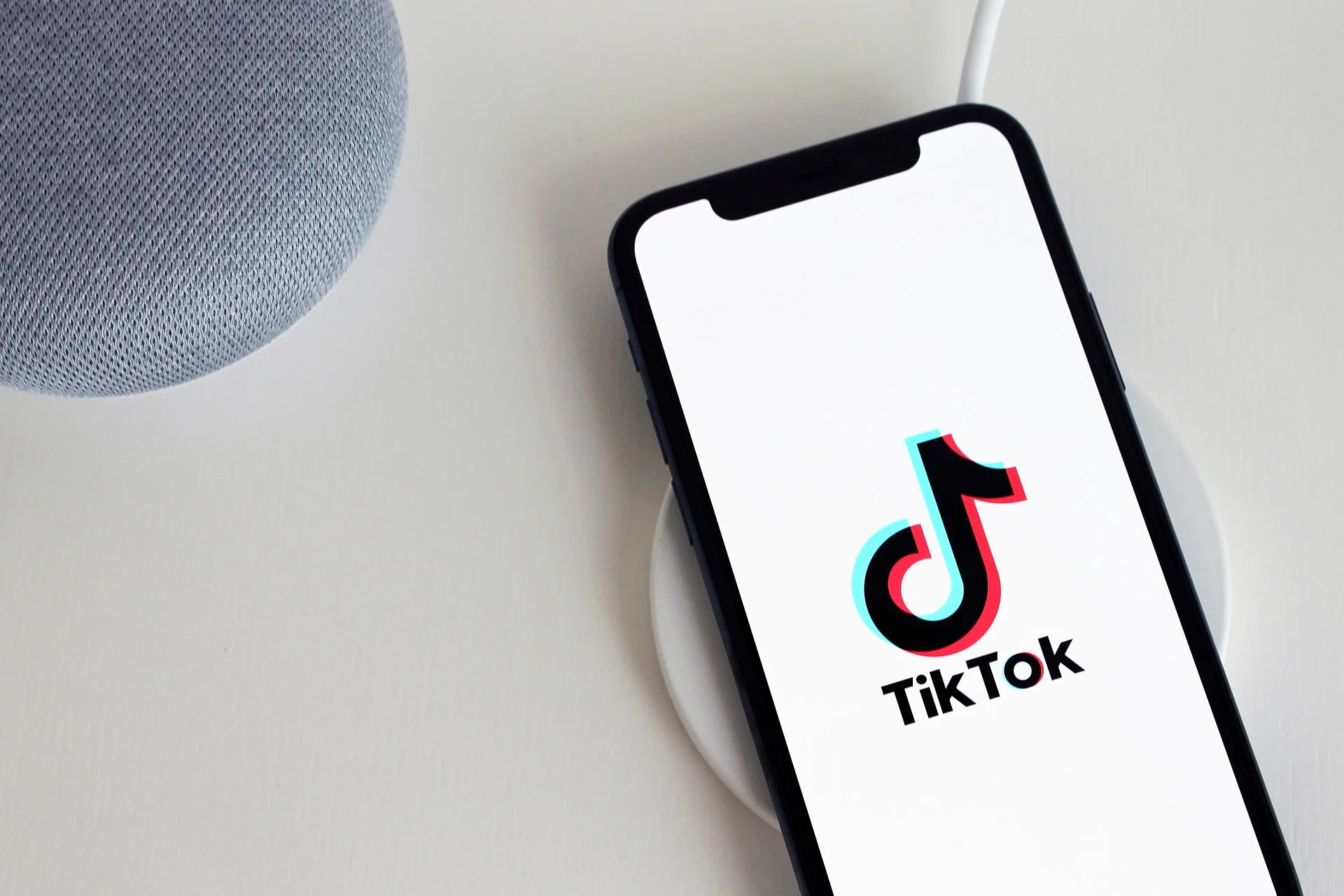 A smartphone displaying the TikTok app logo.