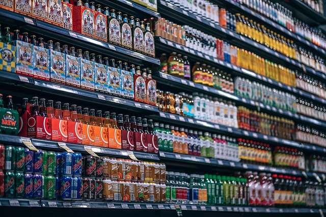 Diverse assortment of beverage brands on a grocery store shelf, highlighting CPG retail strategies.