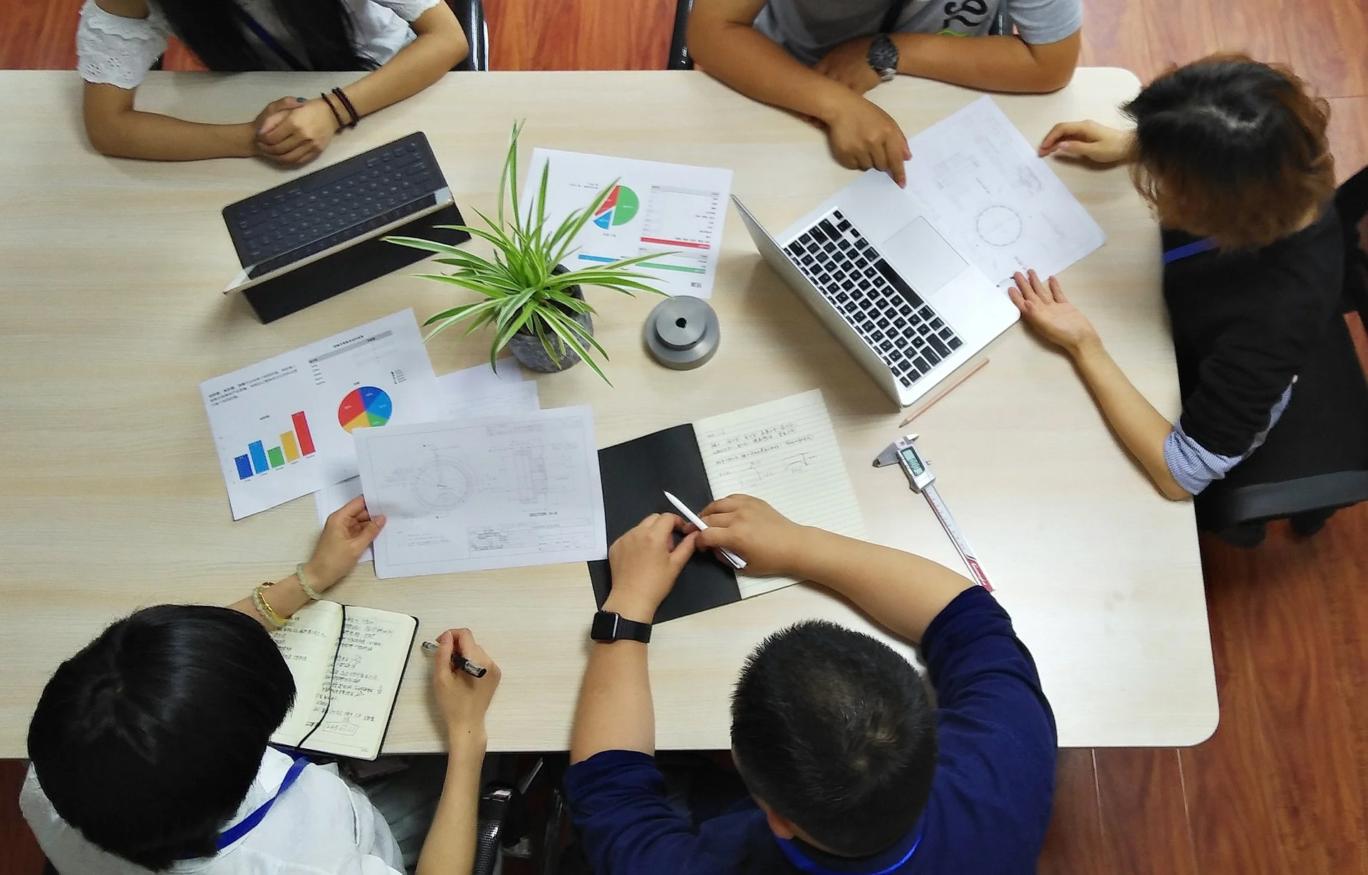 Collaborative team brainstorming marketing campaigns on their computers.