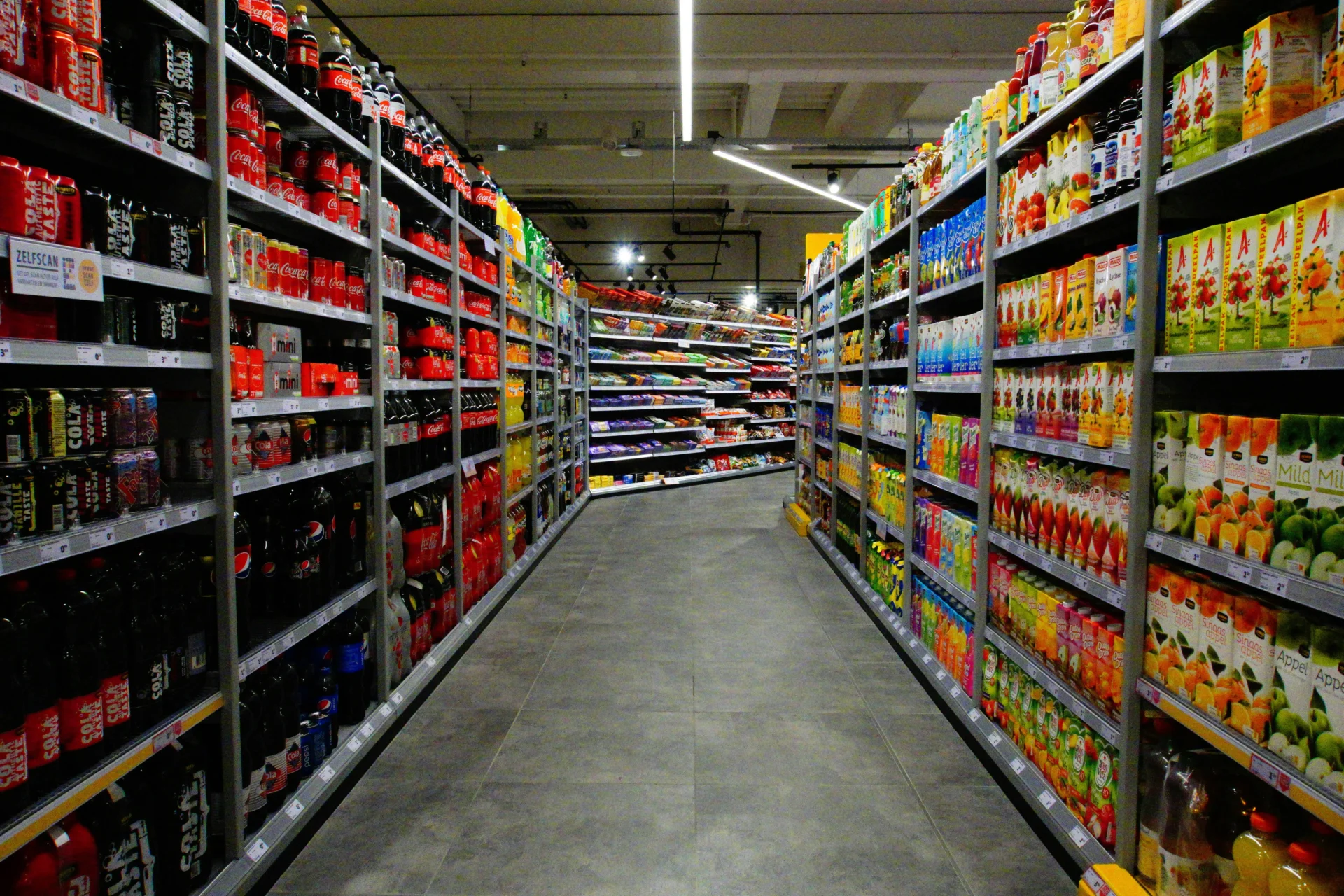 A well-stocked supermarket aisle showcasing various CPG brands.