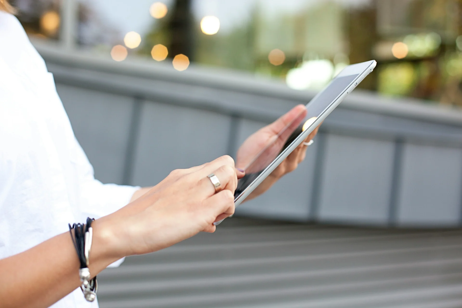 Social media marketing expert using a tablet to manage Facebook Ads campaigns.