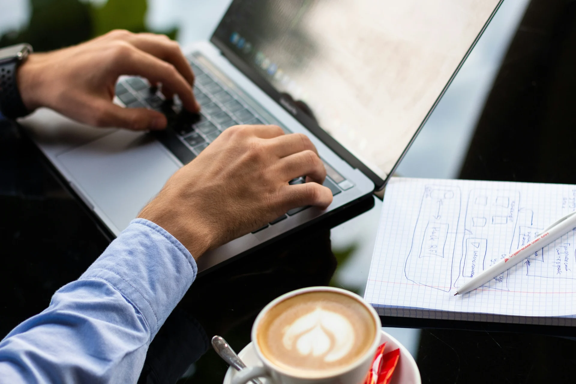 Person working on a laptop, implementing a content optimization strategy