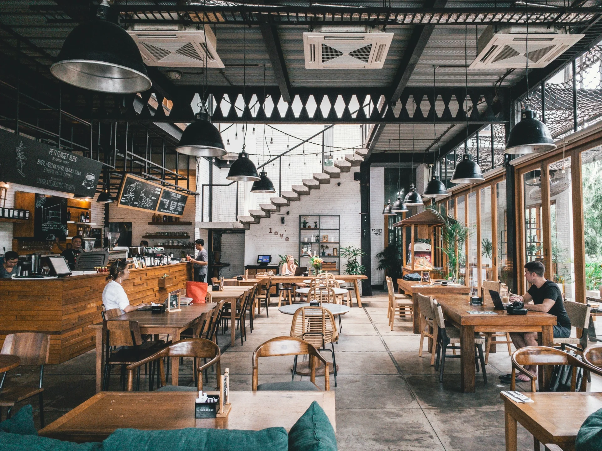 Interior of a restaurant with patrons, representing Google Ads for restaurants potential reach.