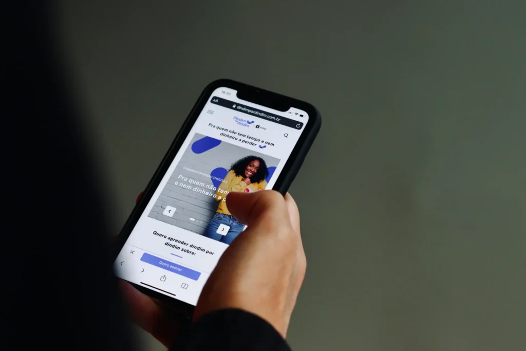 Person using a mobile phone, possibly accessing a CEO's guide to content marketing.