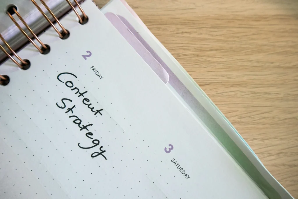 Planner open to a page with "Content Strategy" handwritten, alongside "2 FRIDAY."