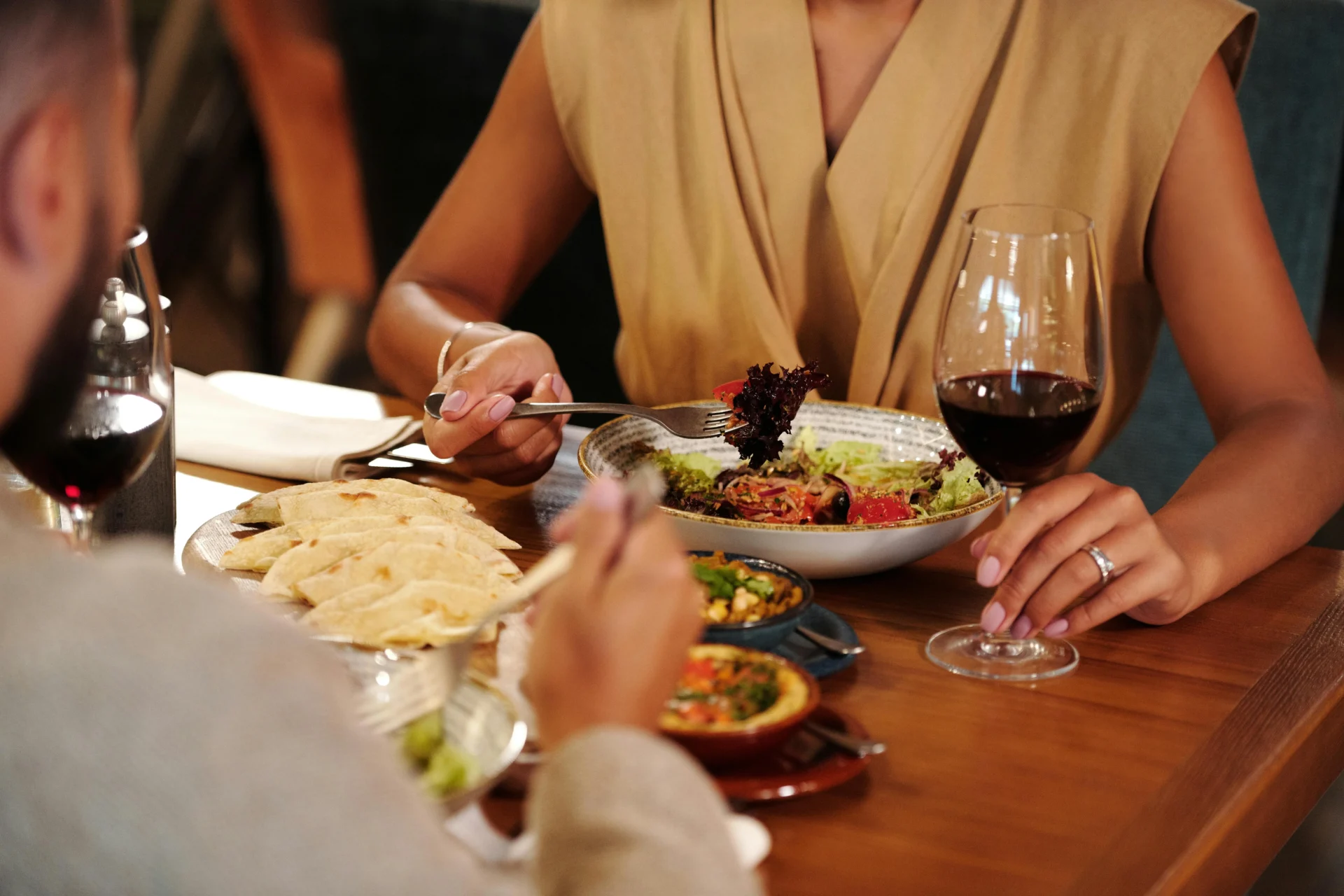 A couple on a dinner date, a scene often used in high-end celebrity food advertisements.