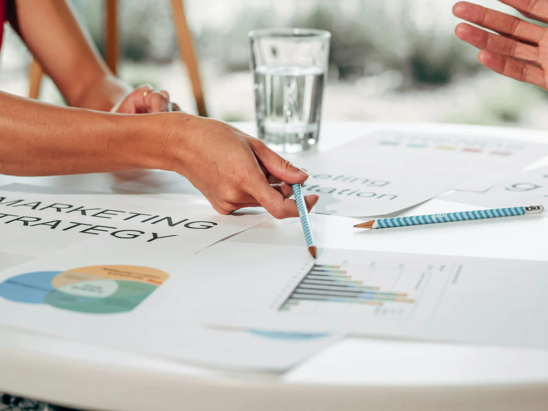 Marketing team analyzing reports on hyperlocal marketing trends and campaign performance.