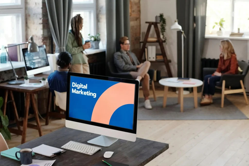 Digital marketing team collaborating in a modern office while discussing brand trust signals in content and strategies for improving online credibility.