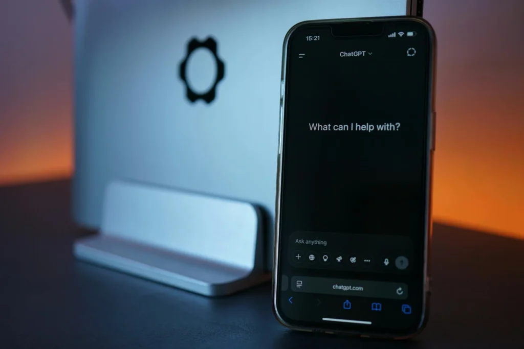 Smartphone displaying ChatGPT interface demonstrating how to optimize for ChatGPT search in dark mode setup