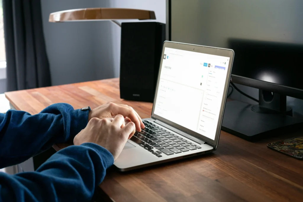 Business owner optimizing a blog post in WordPress, demonstrating GEO for small businesses.