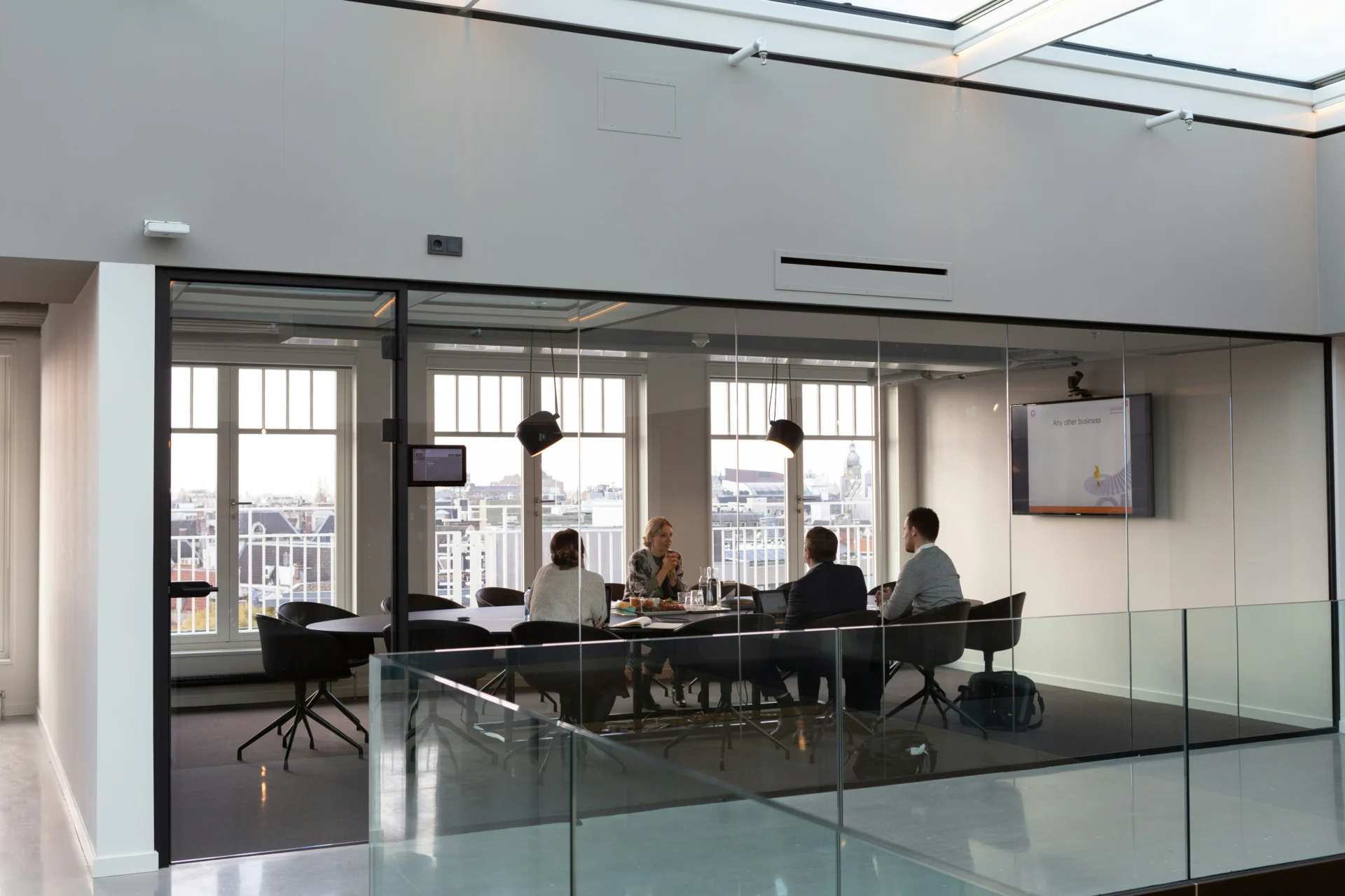 Professionals meeting in a glass conference room to discuss multimodal search optimization strategies