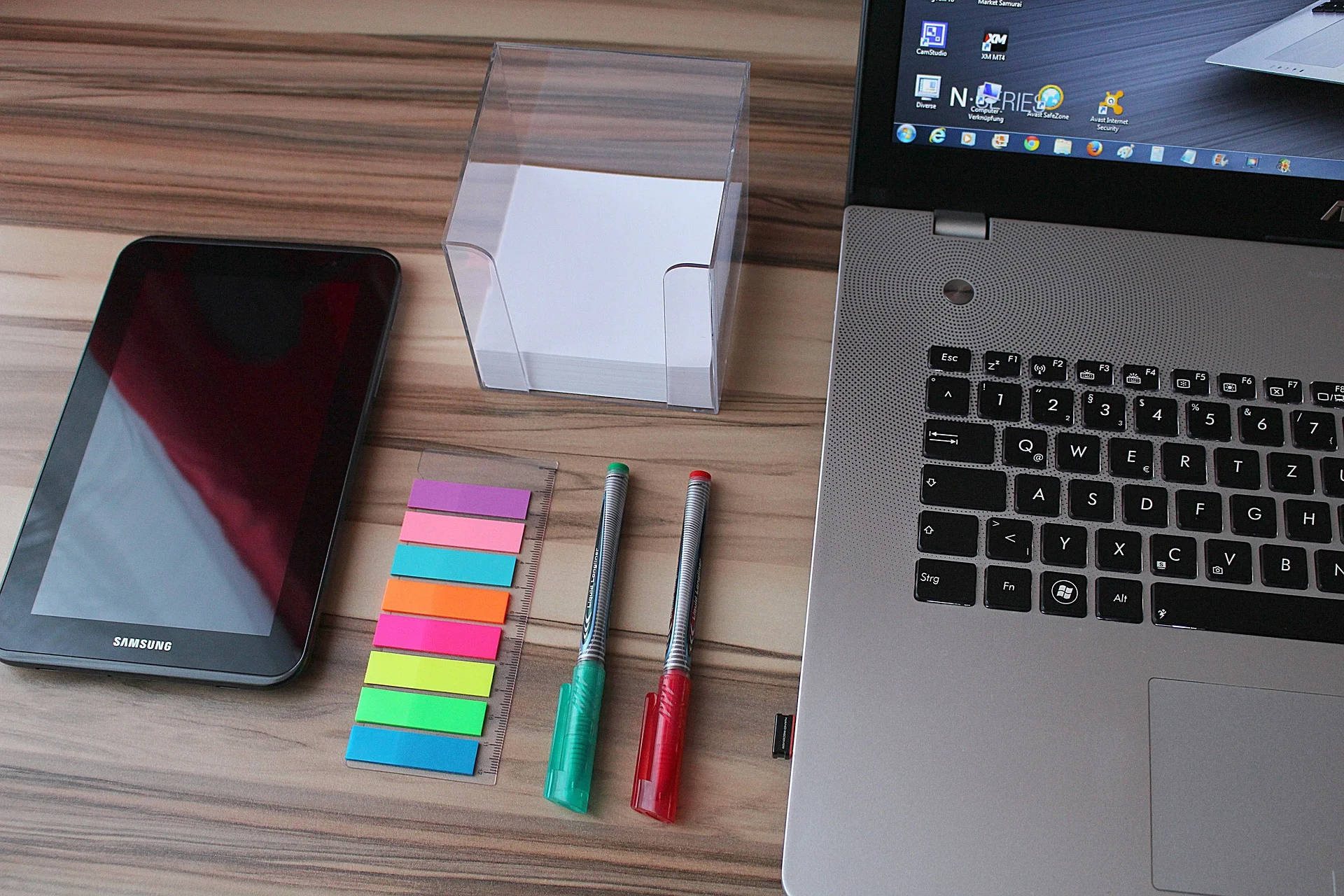 Laptop and tablet on a desk used for planning an AI driven patient acquisition and GEO strategy