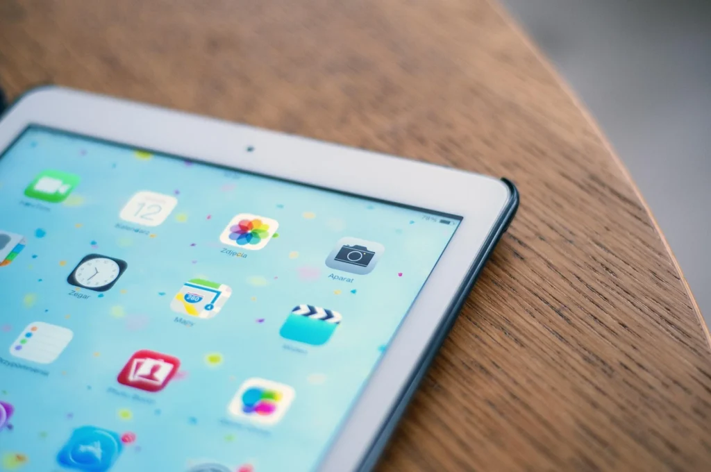 Close-up of tablet home screen representing tools used in a technical GEO strategy.
